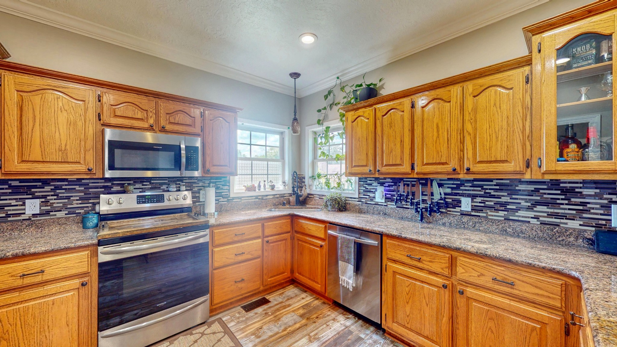 382 Timber Lane Huntingdon, TN 38344 - Photo 21 of 32 a kitchen with stainless steel appliances a sink cabinets and a large window