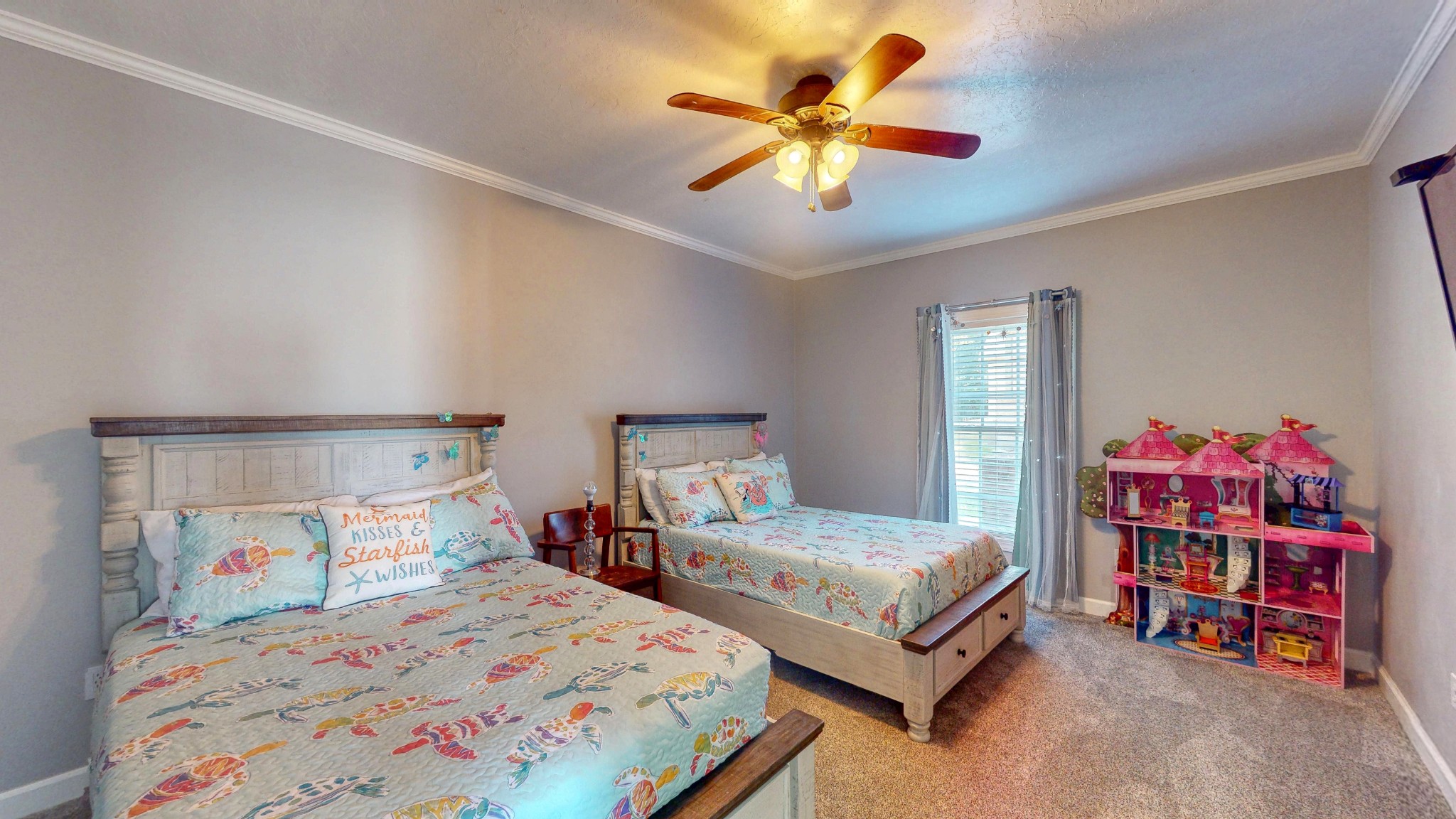 382 Timber Lane Huntingdon, TN 38344 - Photo 29 of 32 a bedroom with a bed and a chandelier