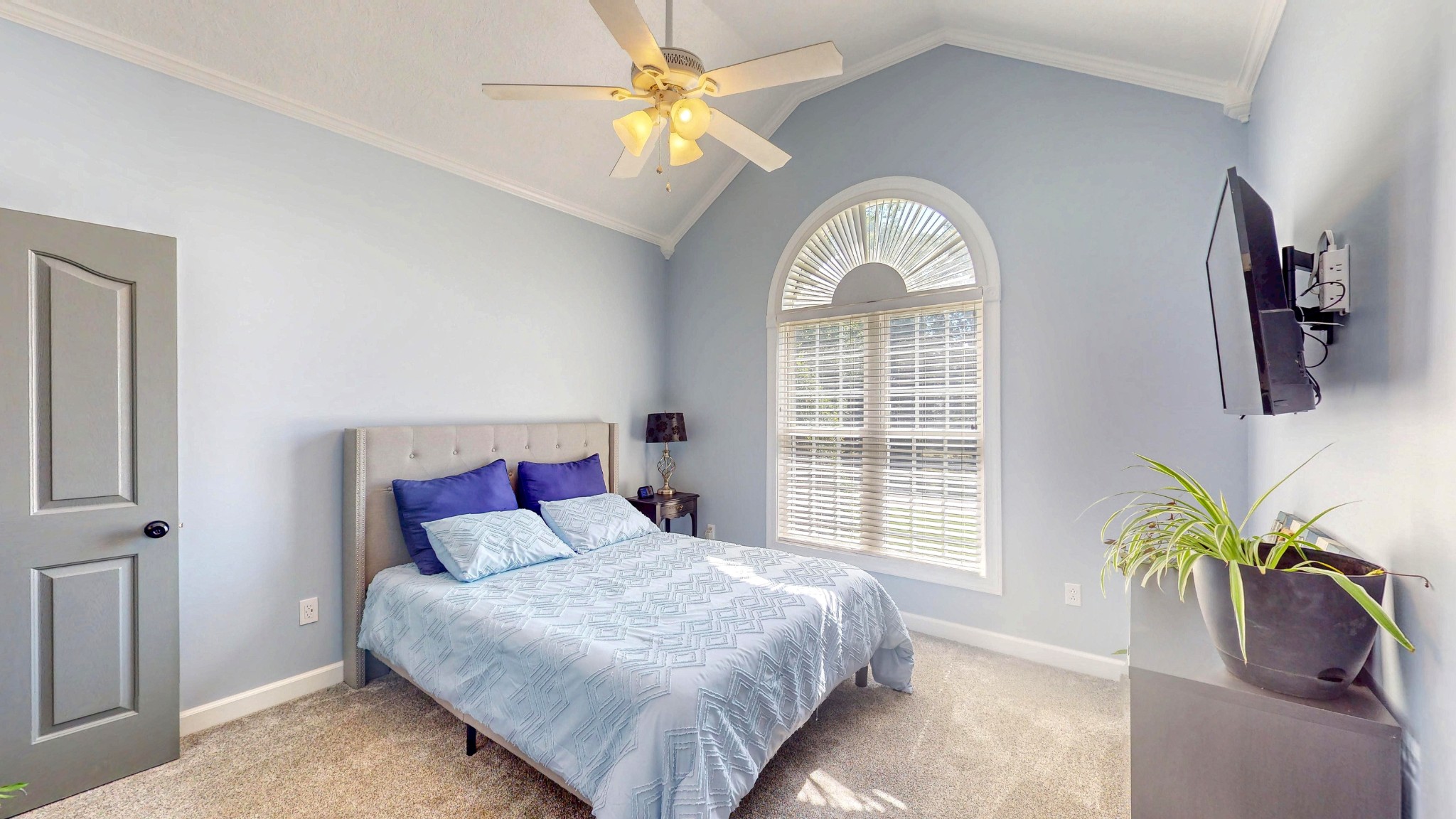 382 Timber Lane Huntingdon, TN 38344 - Photo 31 of 32 a bedroom with a bed and a chandelier