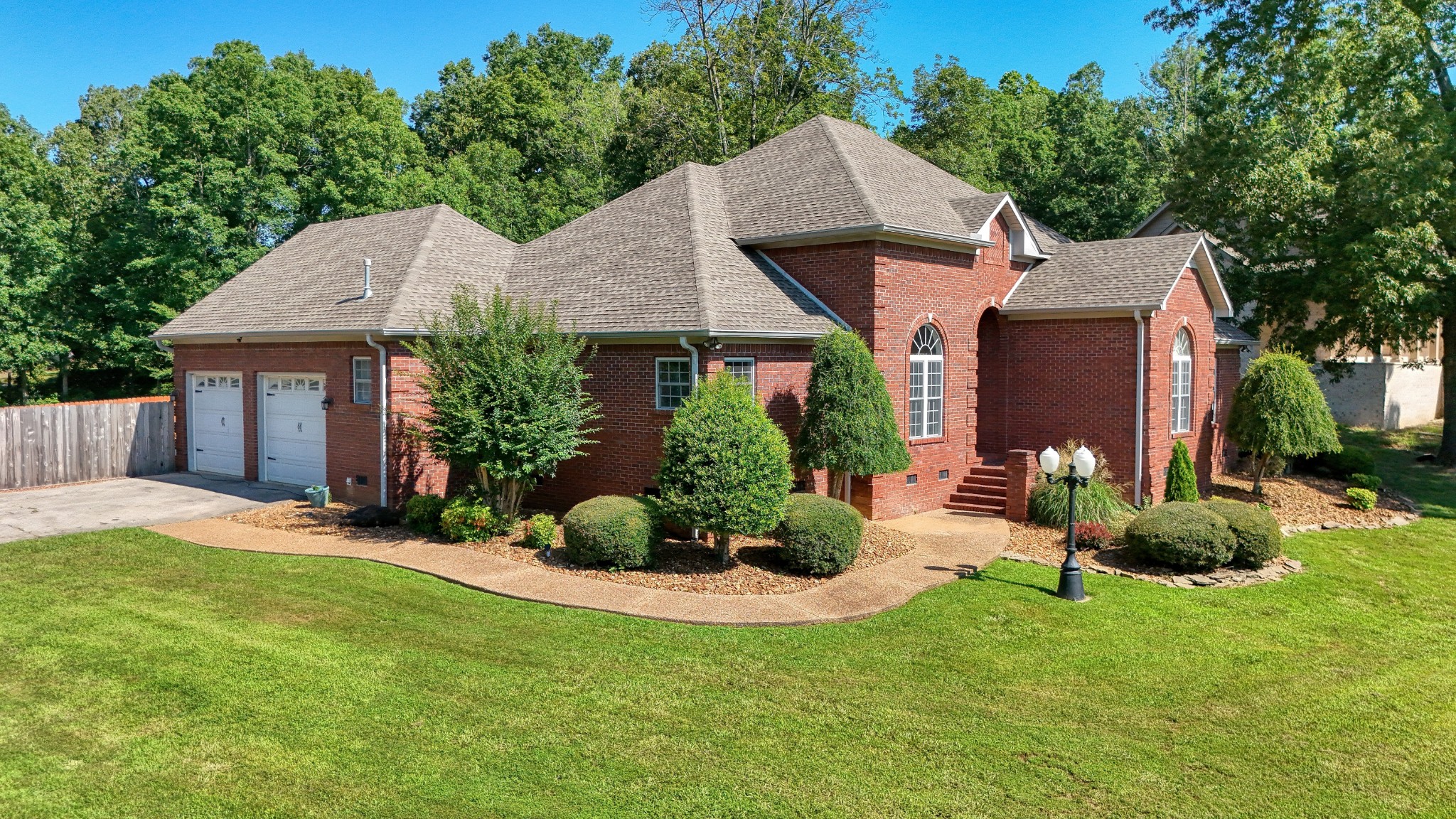 382 Timber Lane Huntingdon, TN 38344 - Photo 8 of 32 a front view of a house with a yard and garage