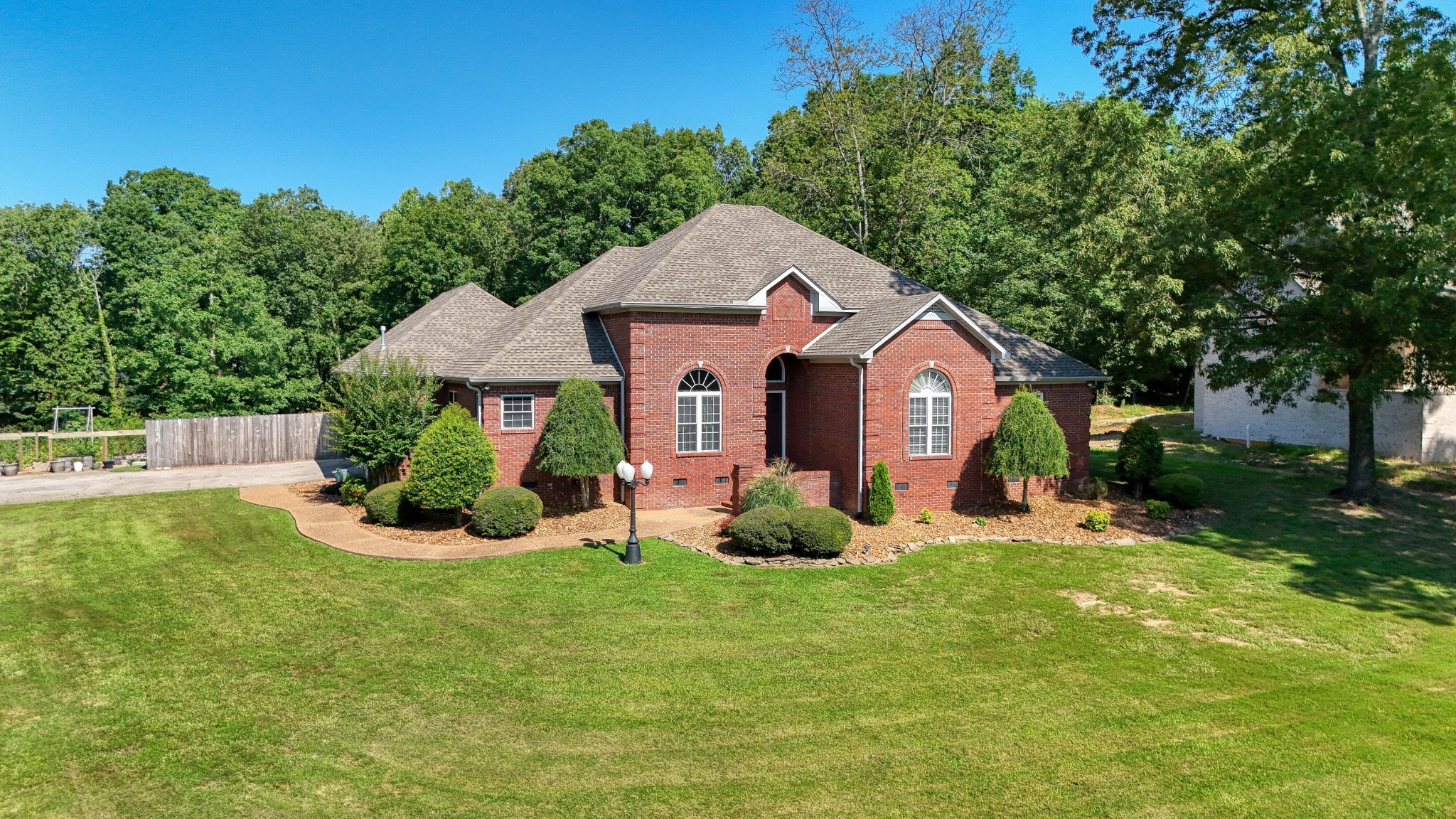 382 Timber Lane Huntingdon, TN 38344 - Photo 10 of 32 a front view of a house with a yard and trees