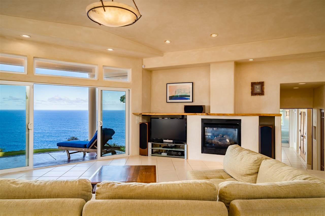 85 East Waipio Road Haiku, HI 96708 - Photo 5 of 28 a living room with furniture fireplace and a flat screen tv