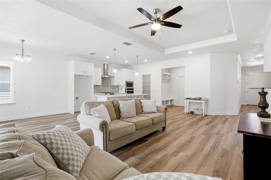 6718 Southwest 10th Lane Gainesville, FL 32607 - Photo 14 of 29 a living room with furniture and a ceiling fan