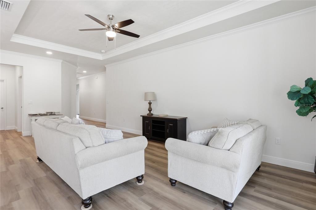 6718 Southwest 10th Lane Gainesville, FL 32607 - Photo 15 of 29 a living room with furniture and a ceiling fan