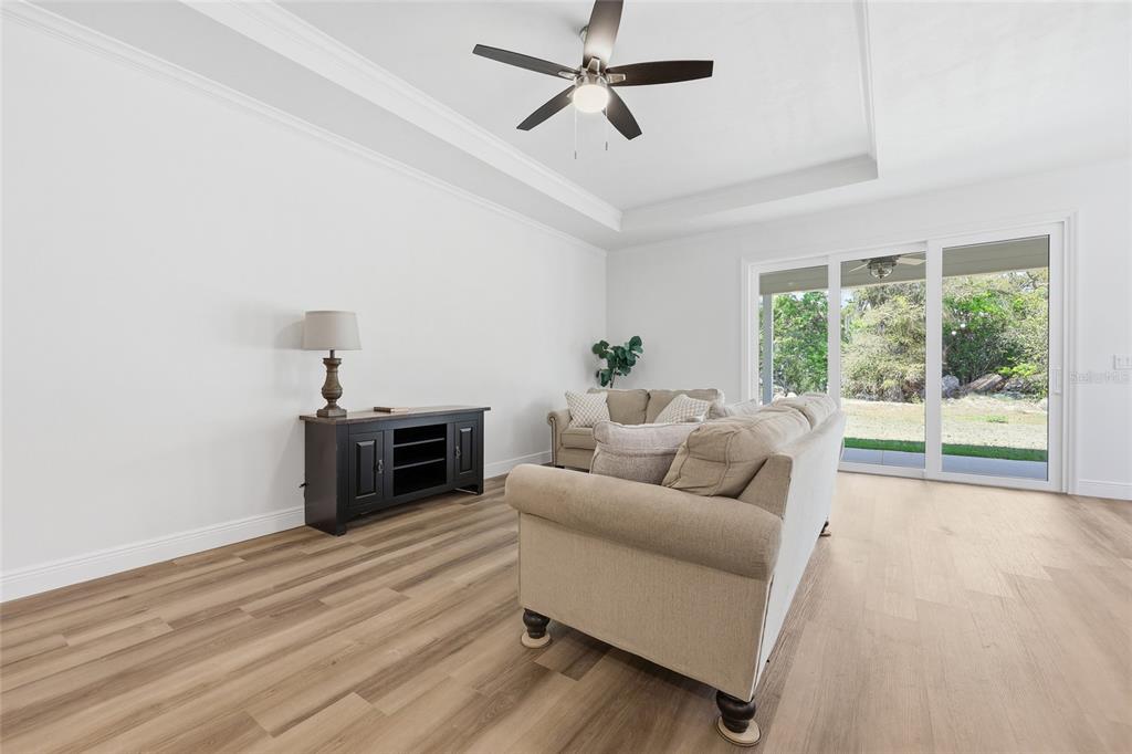 6718 Southwest 10th Lane Gainesville, FL 32607 - Photo 16 of 29 a living room with furniture a window and a flat screen tv
