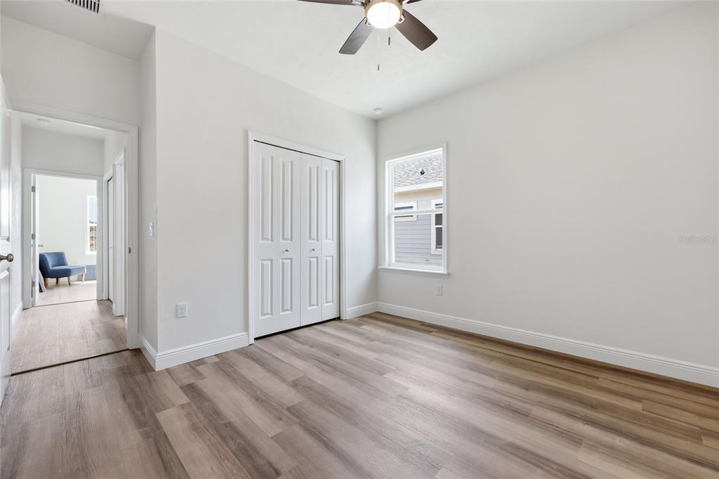 6718 Southwest 10th Lane Gainesville, FL 32607 - Photo 24 of 29 wooden floor in an empty room with a window