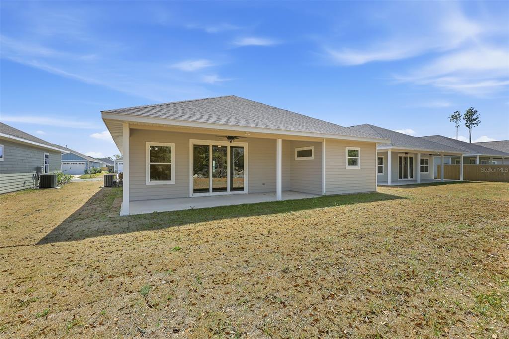 6718 Southwest 10th Lane Gainesville, FL 32607 - Photo 25 of 29 a front view of a house with a yard
