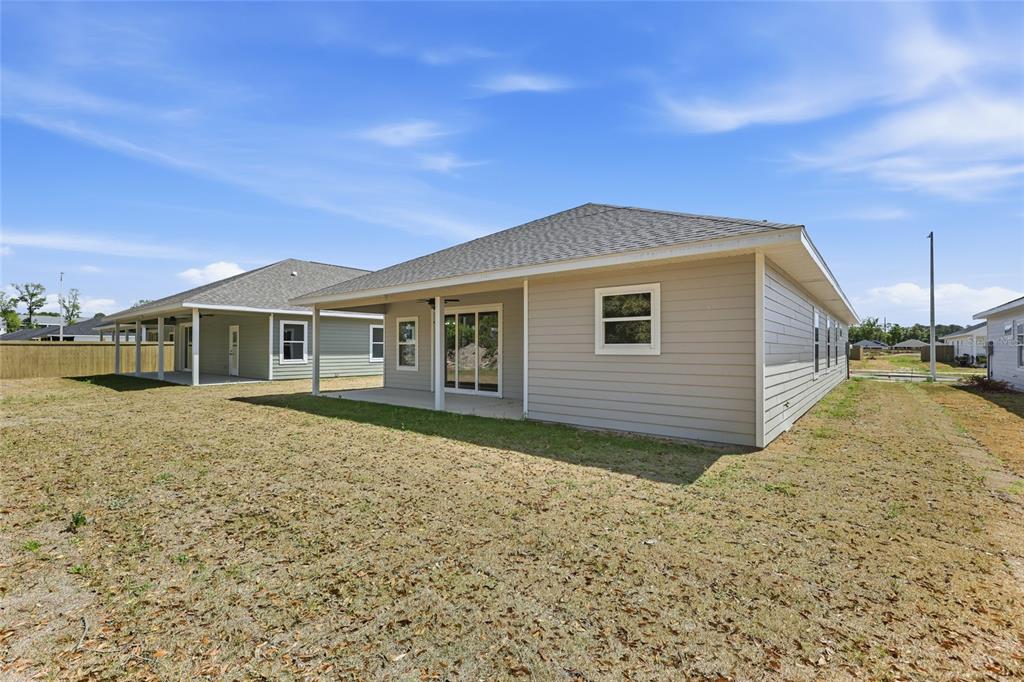 6718 Southwest 10th Lane Gainesville, FL 32607 - Photo 26 of 29 a view of a house with a backyard