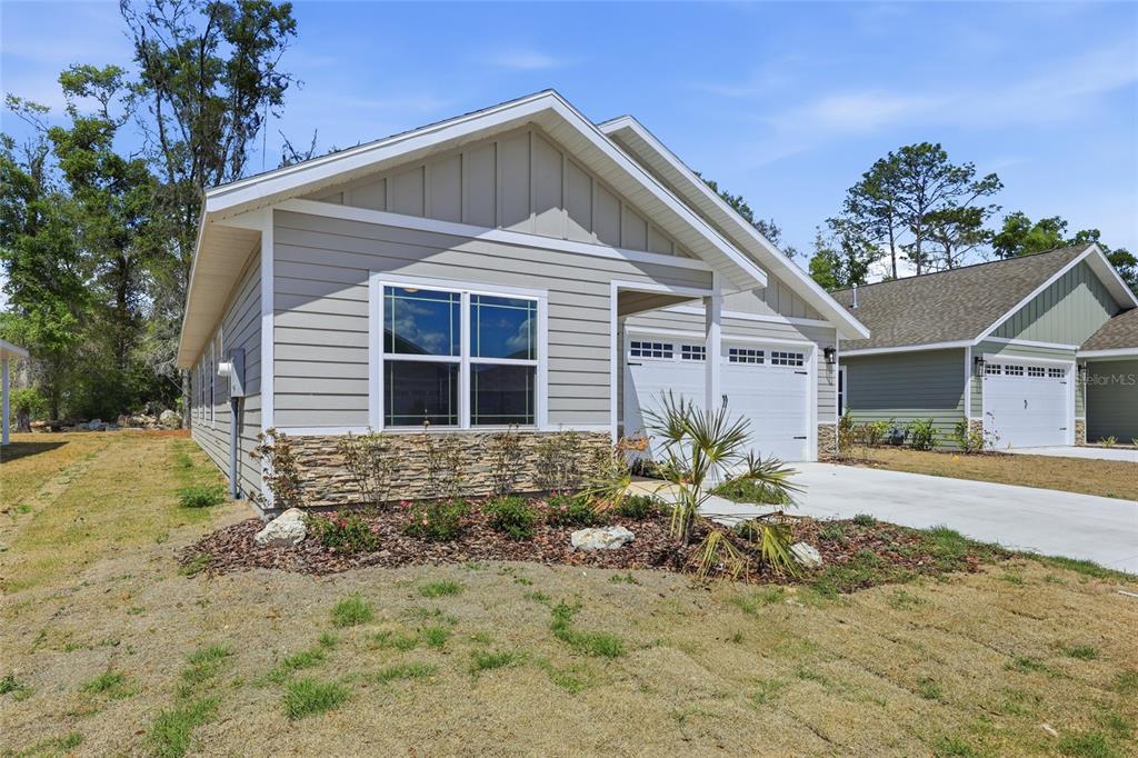 6718 Southwest 10th Lane Gainesville, FL 32607 - Photo 27 of 29 a front view of a house with a yard