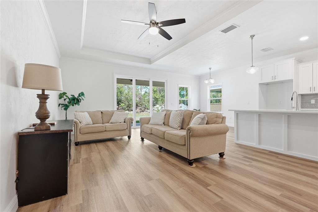 6718 Southwest 10th Lane Gainesville, FL 32607 - Photo 3 of 29 a living room with furniture and a lamp
