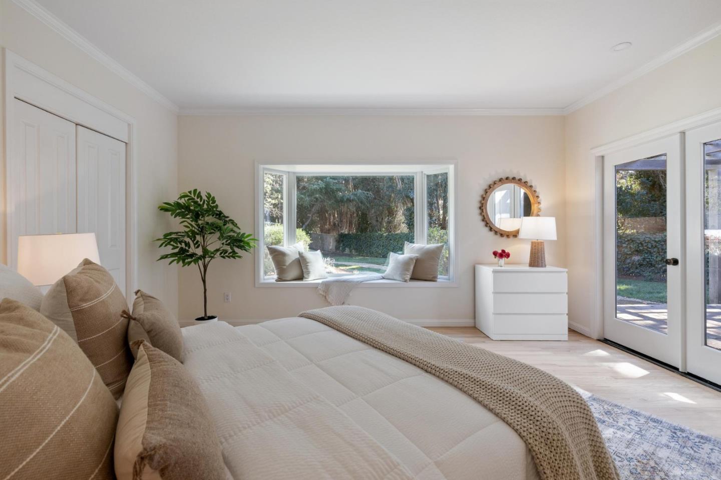 5700 Carmel Valley Road Carmel, CA 93923 - Photo 23 of 66 a bedroom with a large bed and a large window with outer view