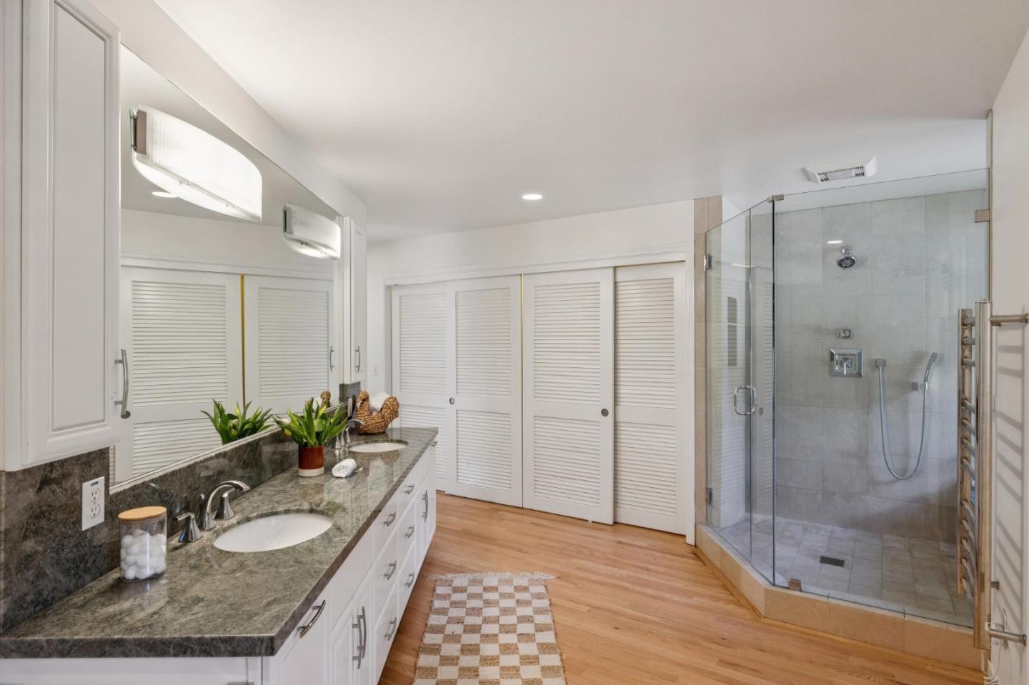 5700 Carmel Valley Road Carmel, CA 93923 - Photo 24 of 66 a bathroom with a granite countertop sink a mirror and a shower