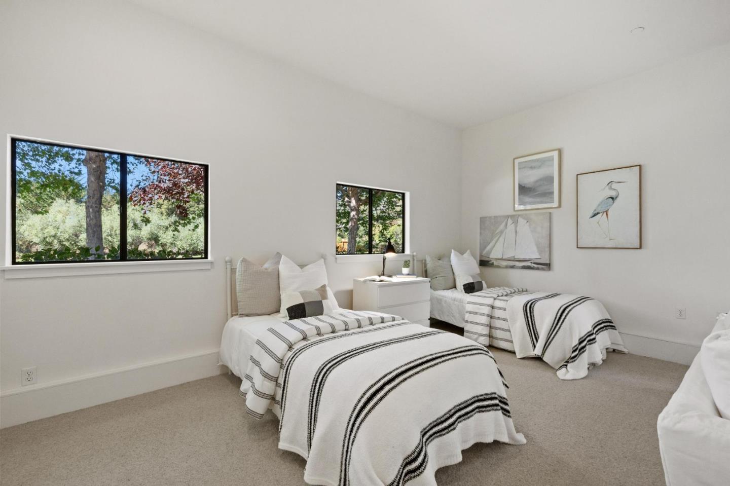 5700 Carmel Valley Road Carmel, CA 93923 - Photo 32 of 66 a bedroom with two beds and a window