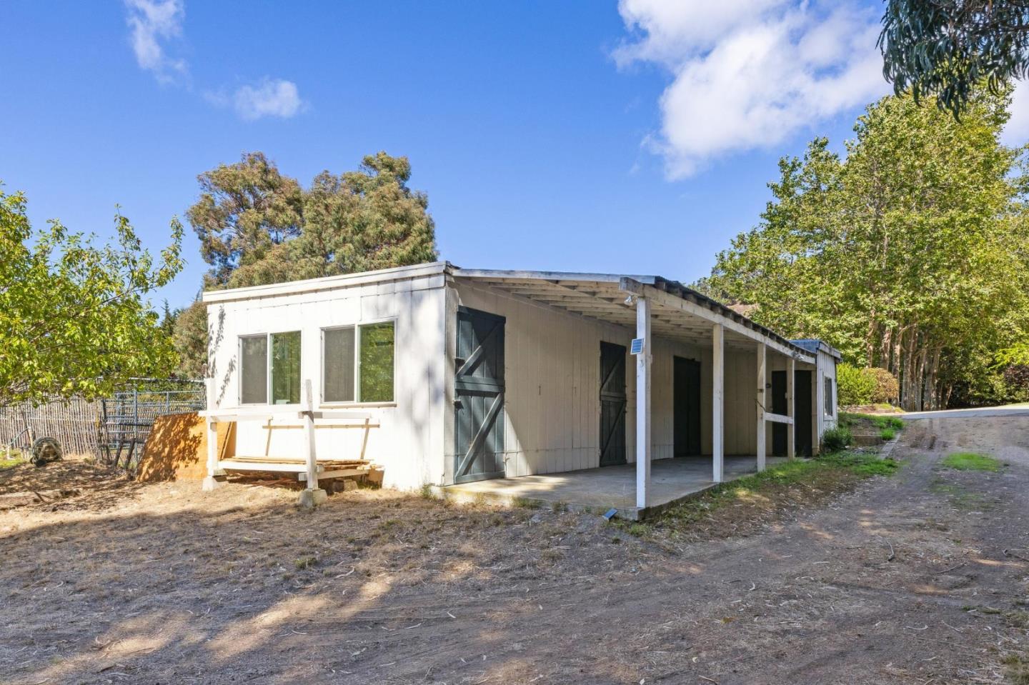 5700 Carmel Valley Road Carmel, CA 93923 - Photo 47 of 66 a view of a house with a yard