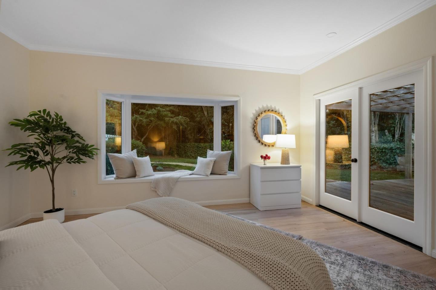 5700 Carmel Valley Road Carmel, CA 93923 - Photo 57 of 66 a bedroom with furniture and large windows