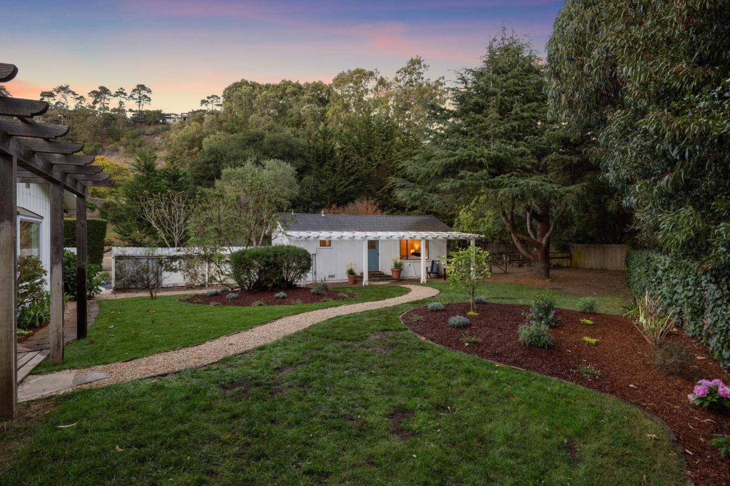 5700 Carmel Valley Road Carmel, CA 93923 - Photo 61 of 66 a front view of a house with a garden