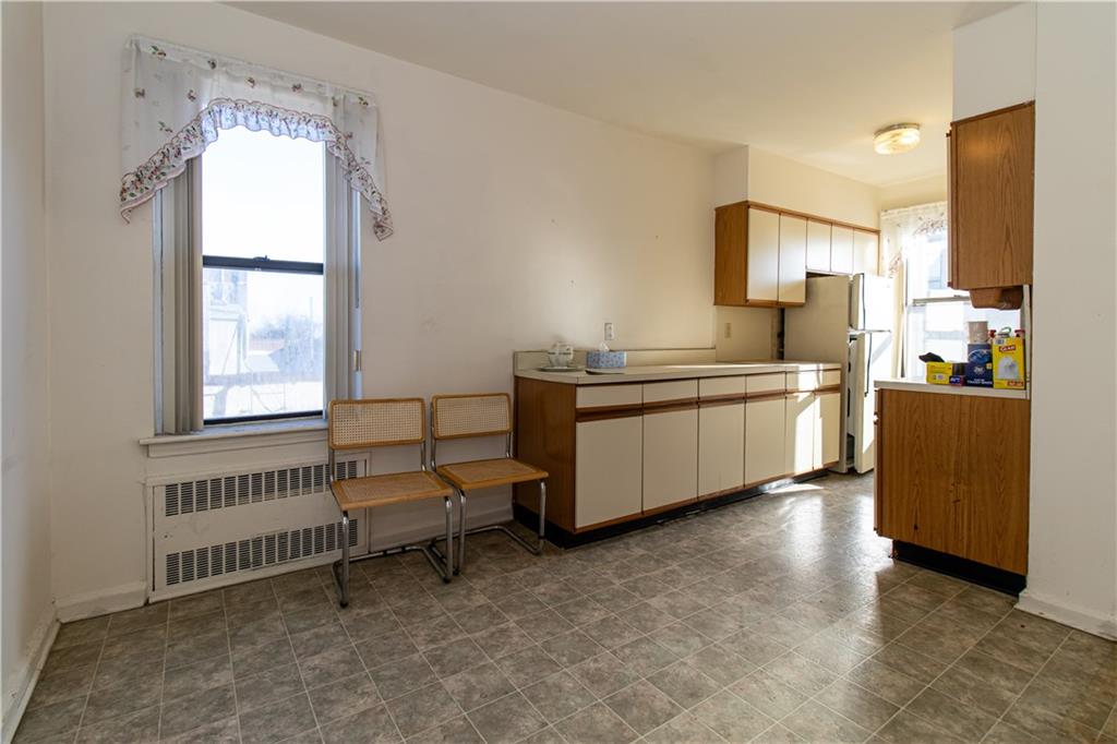 359 Ovington Avenue, Unit D2 Brooklyn, NY 11209 - Photo 14 of 25 a spacious bedroom with a bed and a window