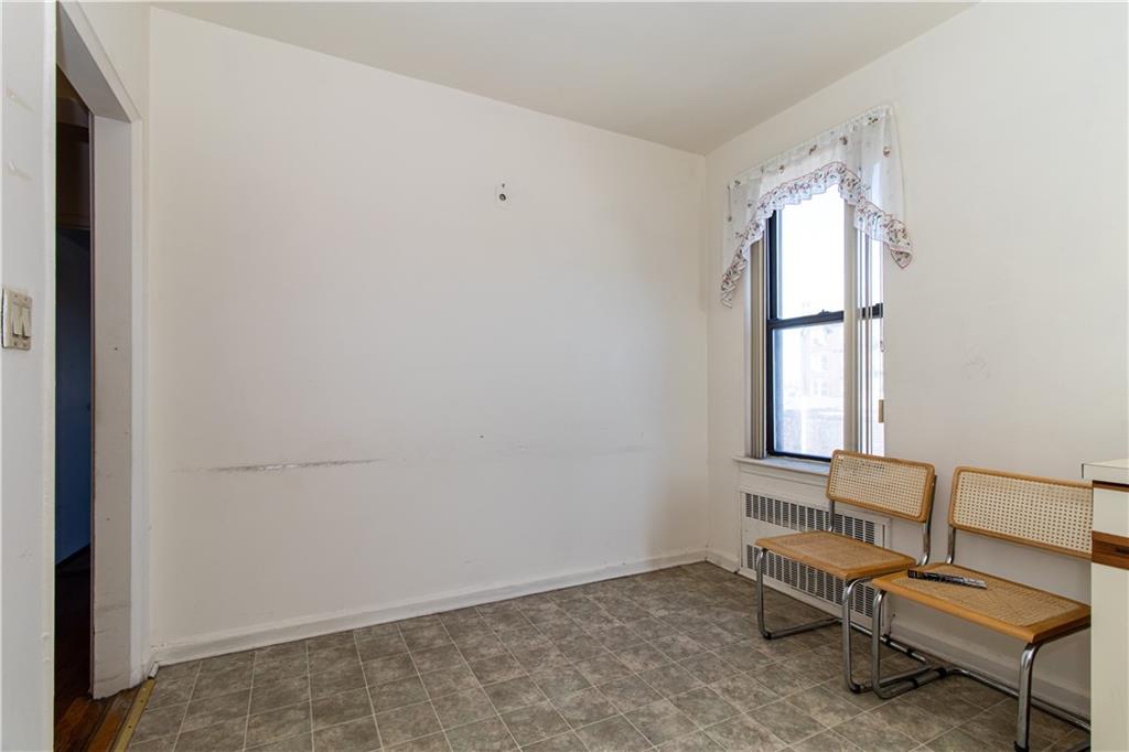 359 Ovington Avenue, Unit D2 Brooklyn, NY 11209 - Photo 15 of 25 a room with windows and a table