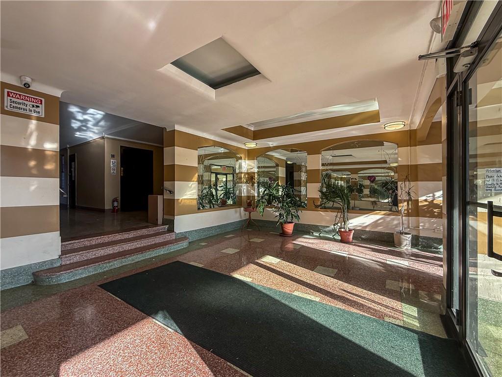 359 Ovington Avenue, Unit D2 Brooklyn, NY 11209 - Photo 24 of 25 a lobby with furniture and a table