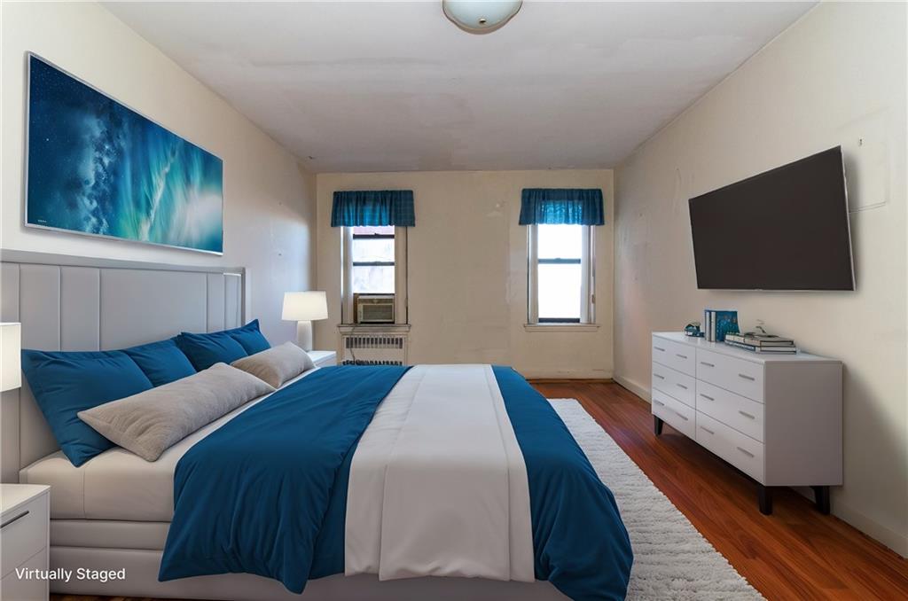 359 Ovington Avenue, Unit D2 Brooklyn, NY 11209 - Photo 4 of 25 a bedroom with a bed and a flat screen tv