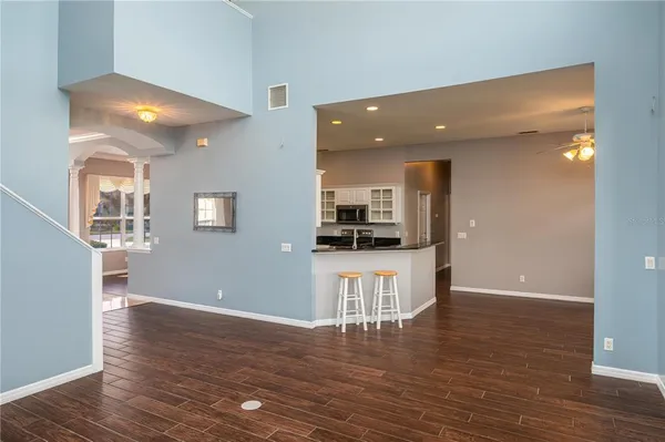 a view of an entryway with wooden floor