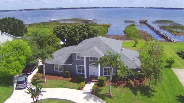 aerial view of a house with large garden and plants