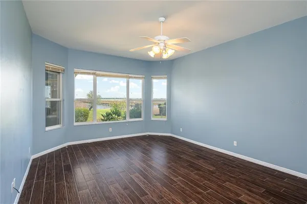 a view of bedroom with window and hardwood floor