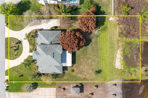 a view of swimming pool with a garden and lake view