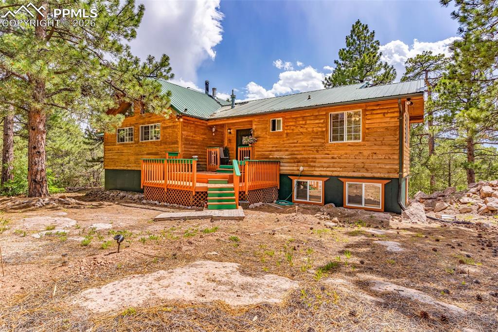 209 Rosewood Road Westcliffe, CO 81252 - Photo 6 of 49 Covered entry and wood deck