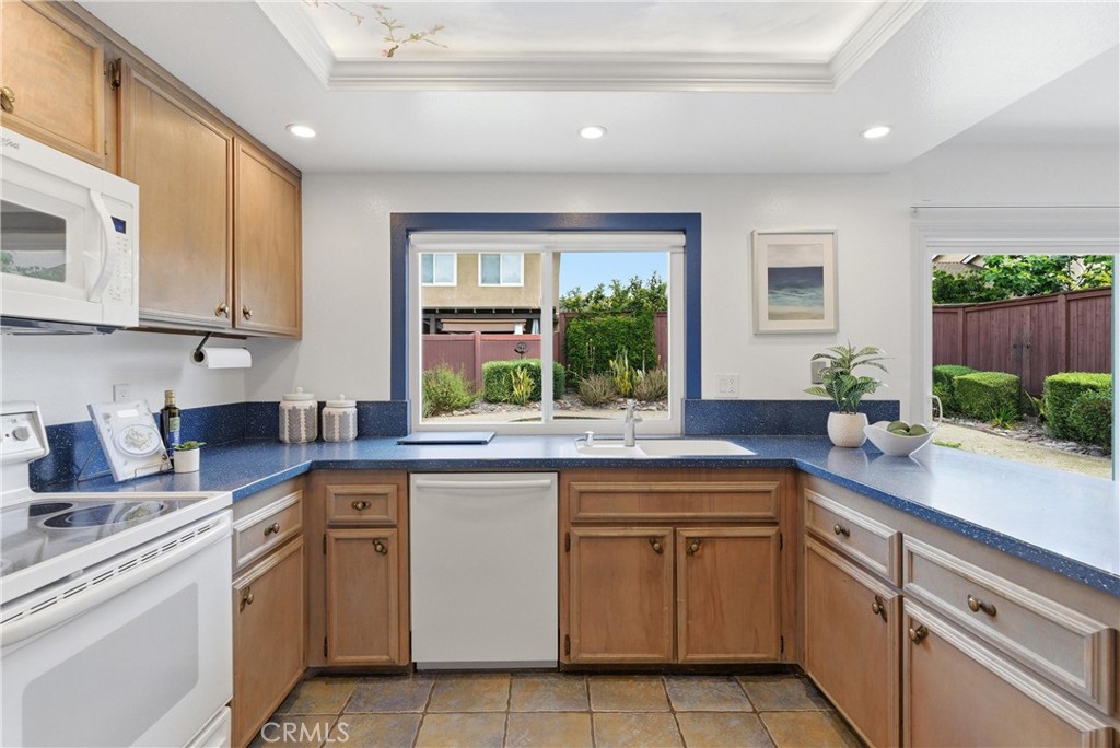 233 Brookshire Place Brea, CA 92821 - Photo 18 of 46 a kitchen with a sink stove and cabinets