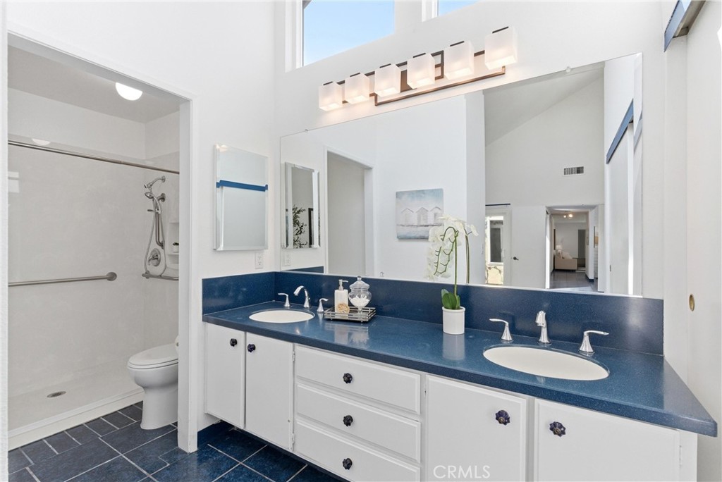 233 Brookshire Place Brea, CA 92821 - Photo 26 of 46 a bathroom with a granite countertop sink a toilet and a mirror