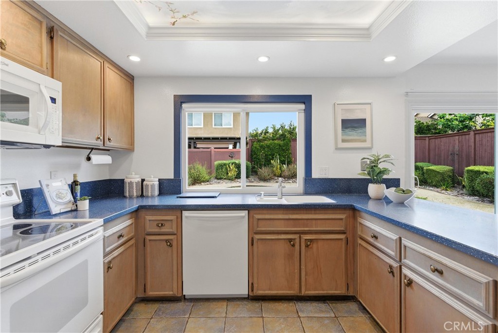 233 Brookshire Place Brea, CA 92821 - Photo 5 of 46 a kitchen with a sink stove and cabinets