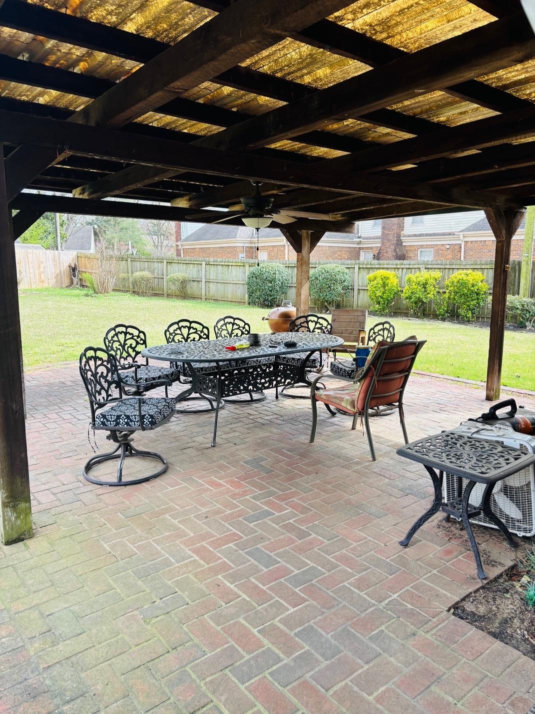 2076 Riverdale Road Germantown, TN 38138 - Photo 17 of 21 Fenced backyard featuring a patio area, outdoor dining space, and ceiling fan