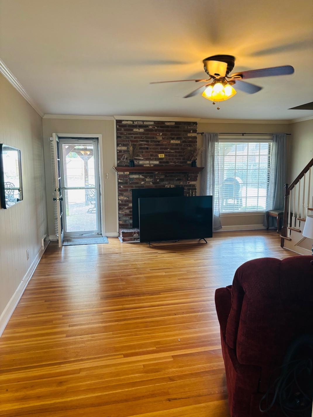 2076 Riverdale Road Germantown, TN 38138 - Photo 7 of 21 Living room with ornamental molding, ceiling fan, and light wood-style flooring