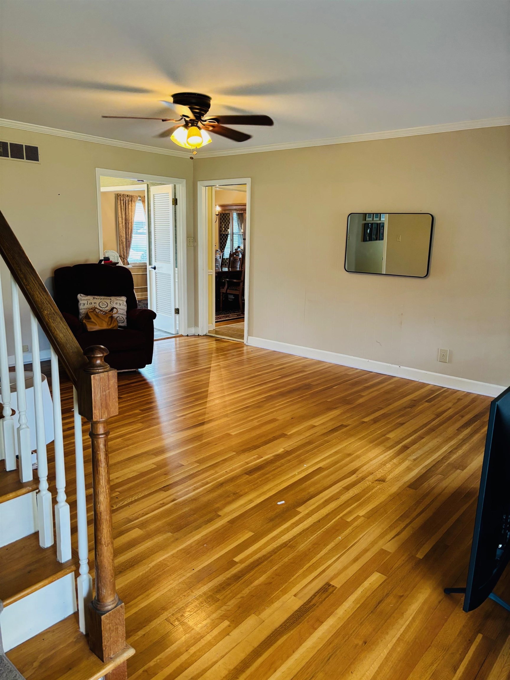 2076 Riverdale Road Germantown, TN 38138 - Photo 8 of 21 Living area featuring wood-type flooring, ornamental molding, and ceiling fan