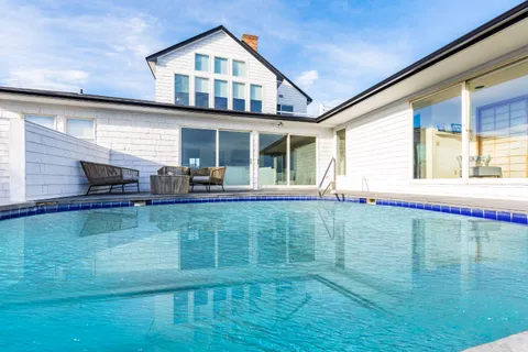 a front view of a house with swimming pool