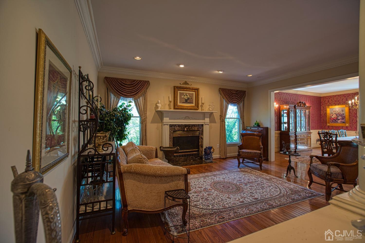 17 Grovers Mill Road Plainsboro, NJ 08536 - Photo 18 of 69 a living room with furniture and a fireplace