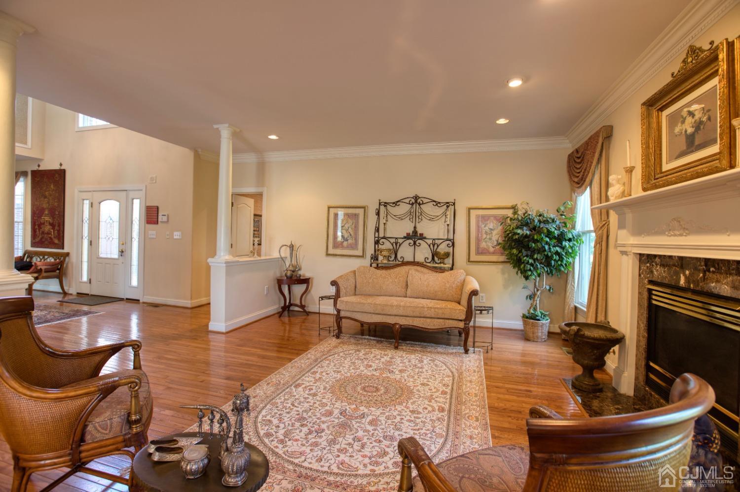 17 Grovers Mill Road Plainsboro, NJ 08536 - Photo 20 of 69 a living room with furniture and a fireplace