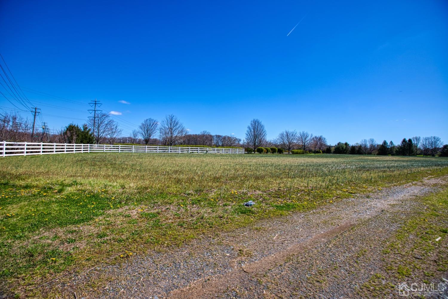 17 Grovers Mill Road Plainsboro, NJ 08536 - Photo 2 of 69 a view of a lake with houses in the background