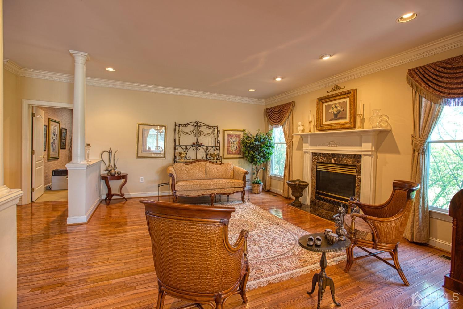 17 Grovers Mill Road Plainsboro, NJ 08536 - Photo 21 of 69 a living room with furniture and a fireplace