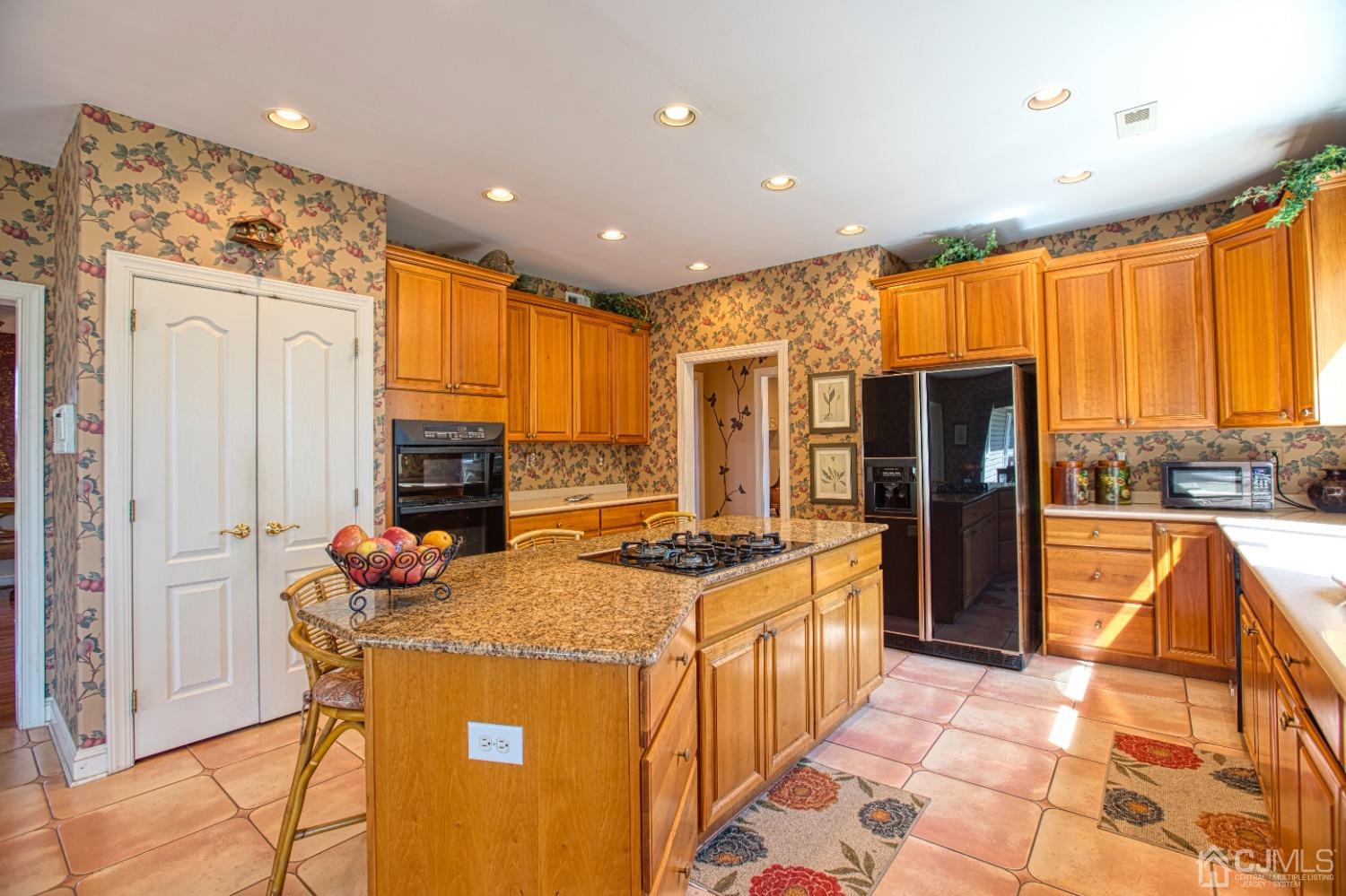 17 Grovers Mill Road Plainsboro, NJ 08536 - Photo 28 of 69 a kitchen with stainless steel appliances granite countertop sink stove refrigerator and cabinets
