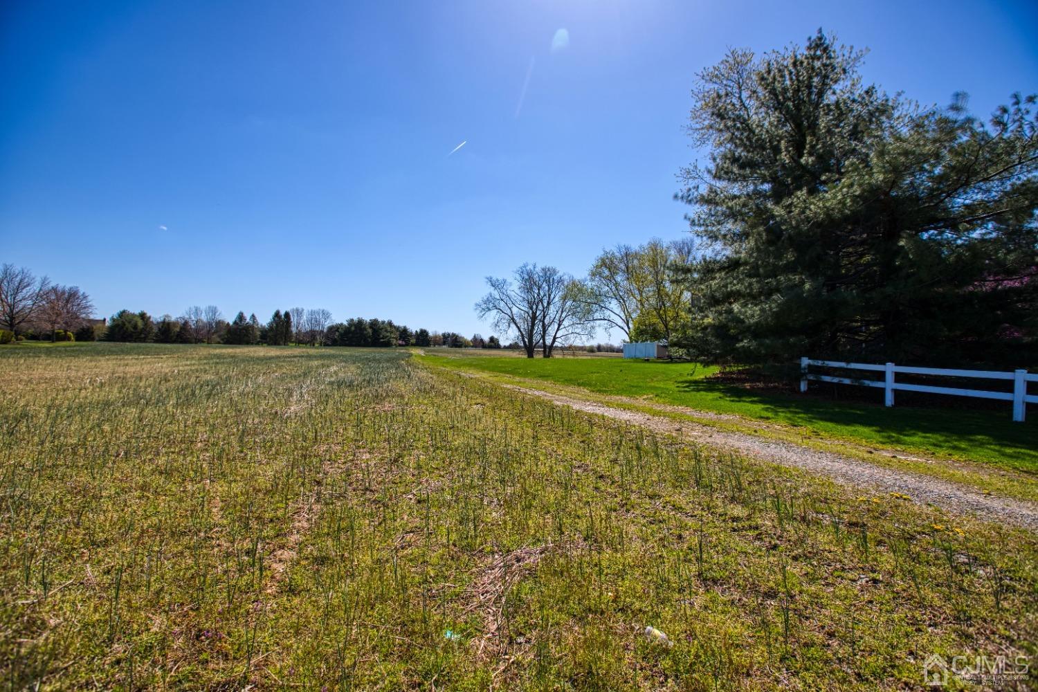 17 Grovers Mill Road Plainsboro, NJ 08536 - Photo 3 of 69 a view of a lake with houses in the background