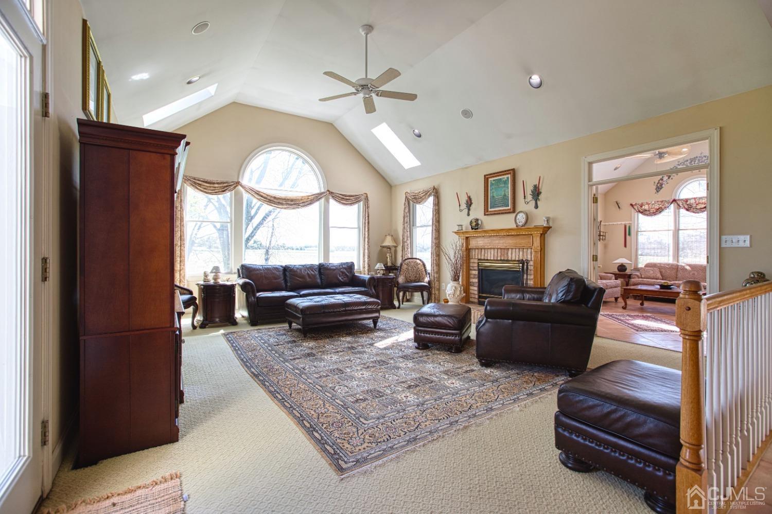 17 Grovers Mill Road Plainsboro, NJ 08536 - Photo 31 of 69 a living room with furniture and a fireplace