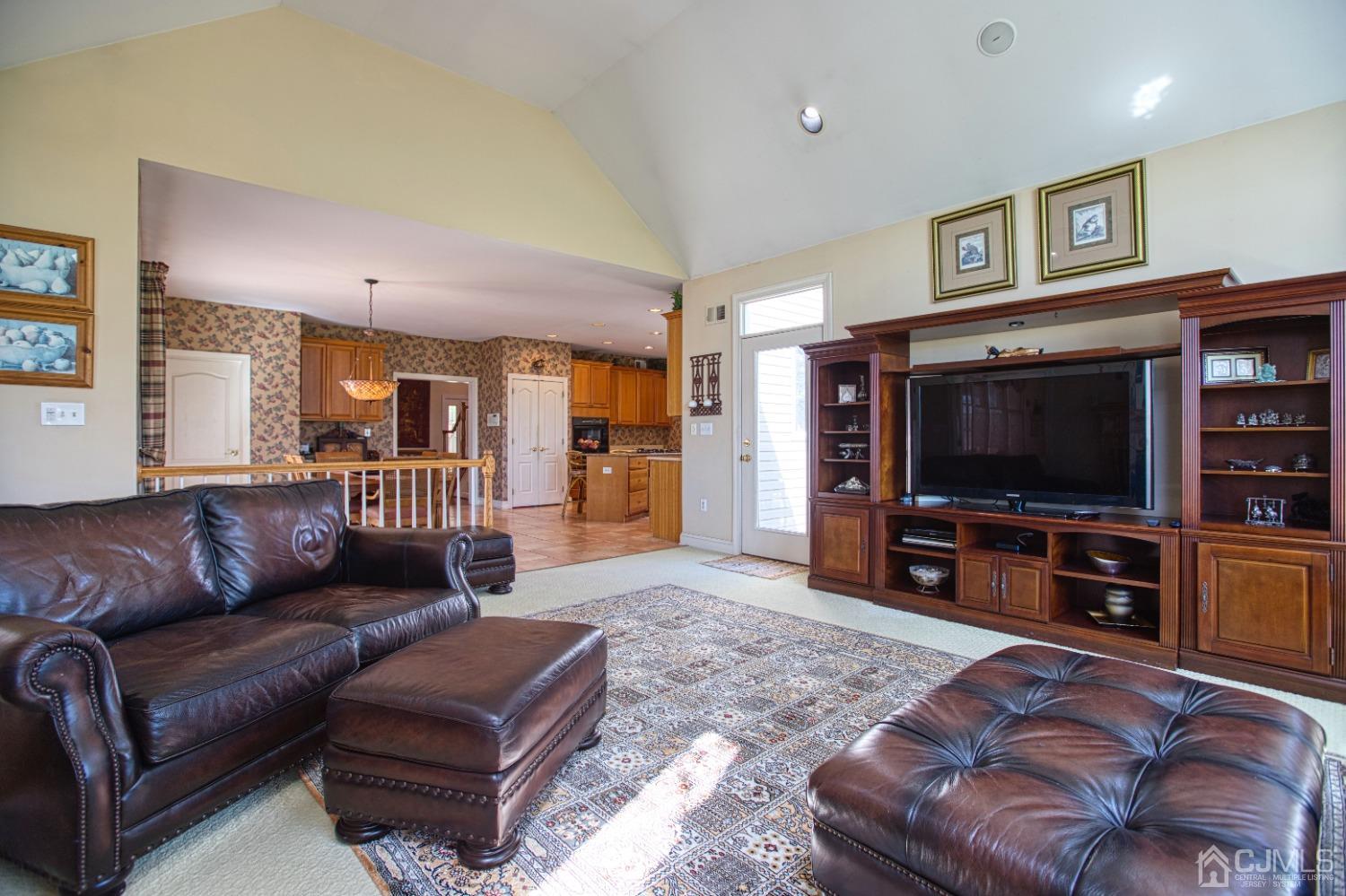 17 Grovers Mill Road Plainsboro, NJ 08536 - Photo 33 of 69 a living room with furniture and a flat screen tv