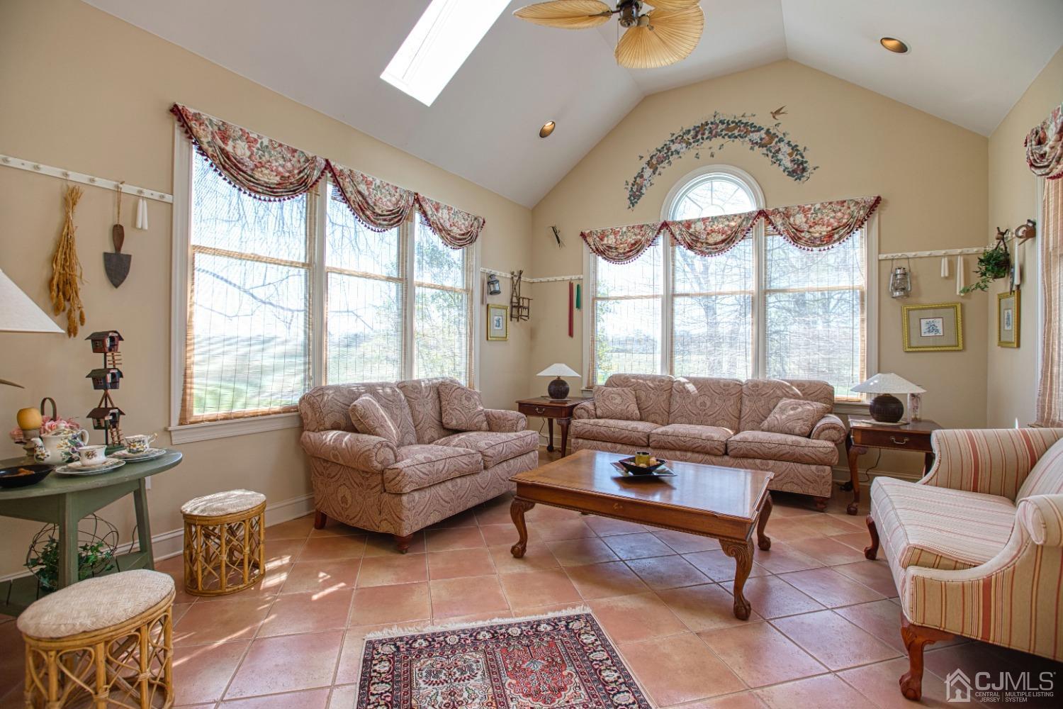 17 Grovers Mill Road Plainsboro, NJ 08536 - Photo 34 of 69 a living room with furniture chandelier and a large window