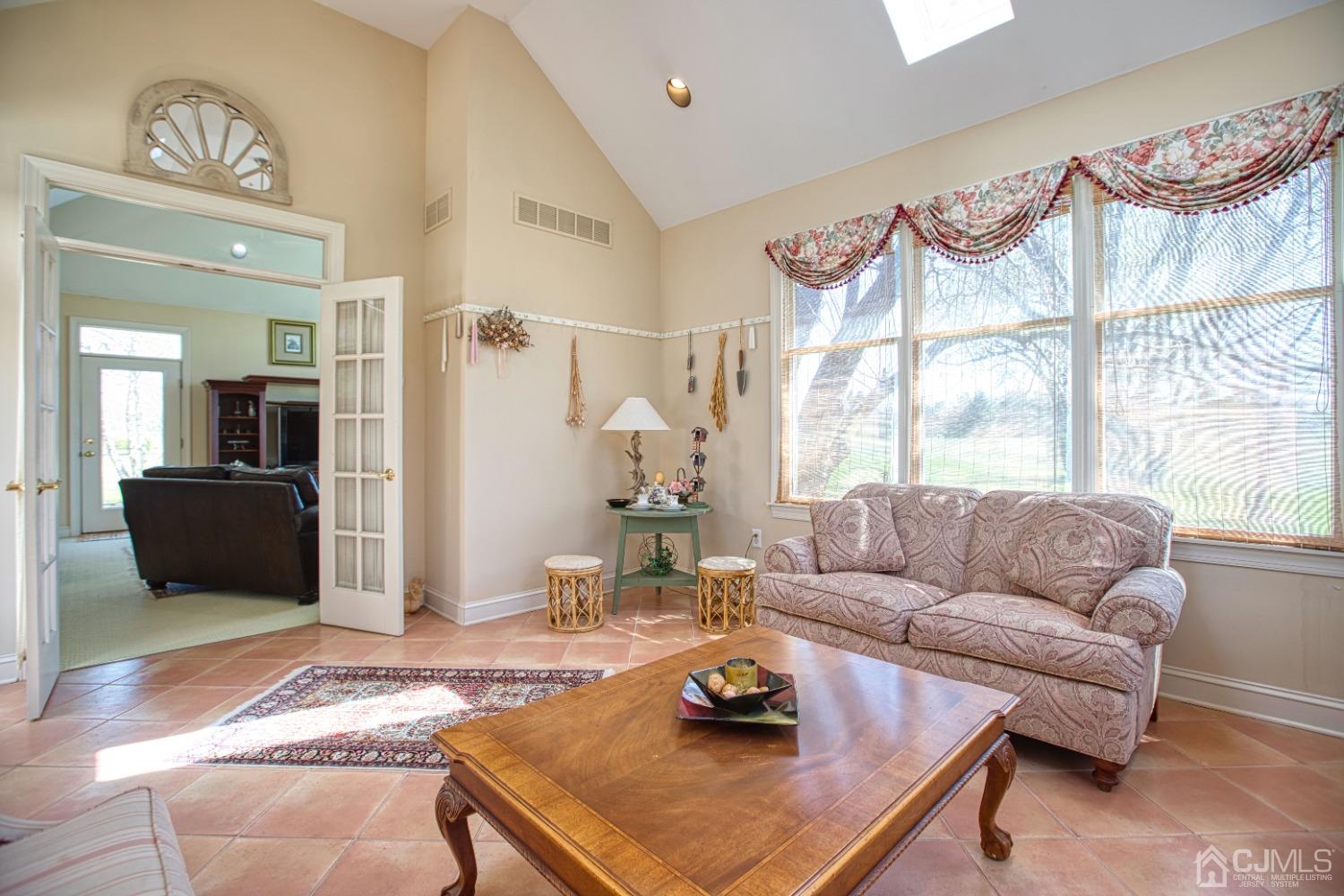 17 Grovers Mill Road Plainsboro, NJ 08536 - Photo 35 of 69 a living room with furniture and a large window