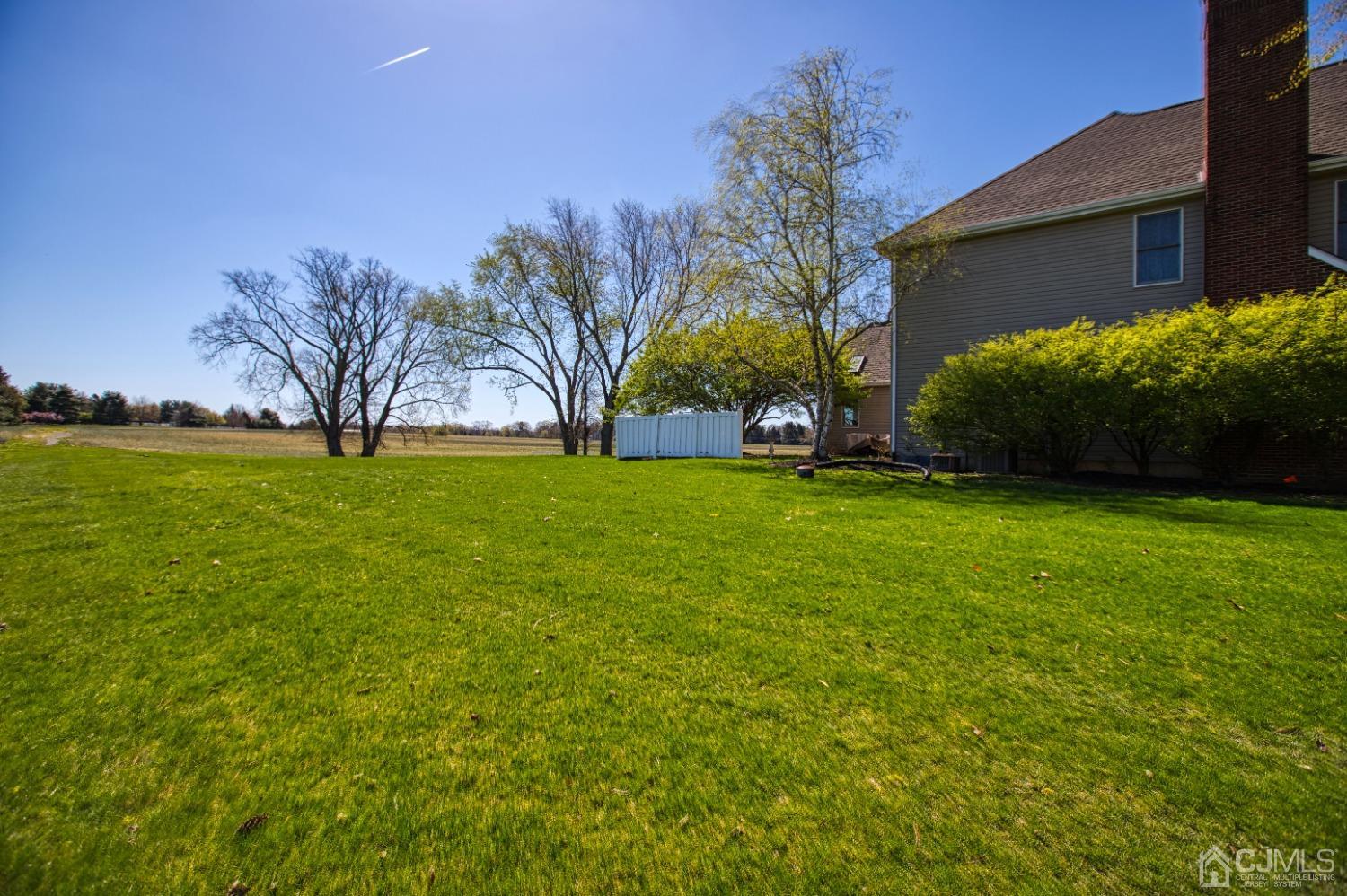17 Grovers Mill Road Plainsboro, NJ 08536 - Photo 4 of 69 a view of a field of grass and trees
