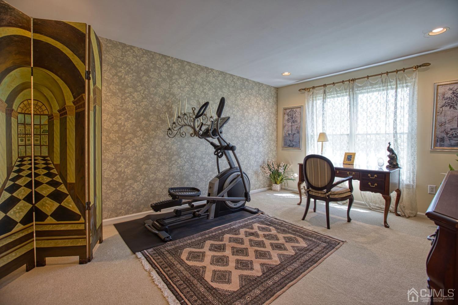17 Grovers Mill Road Plainsboro, NJ 08536 - Photo 49 of 69 a room with gym equipment and windows