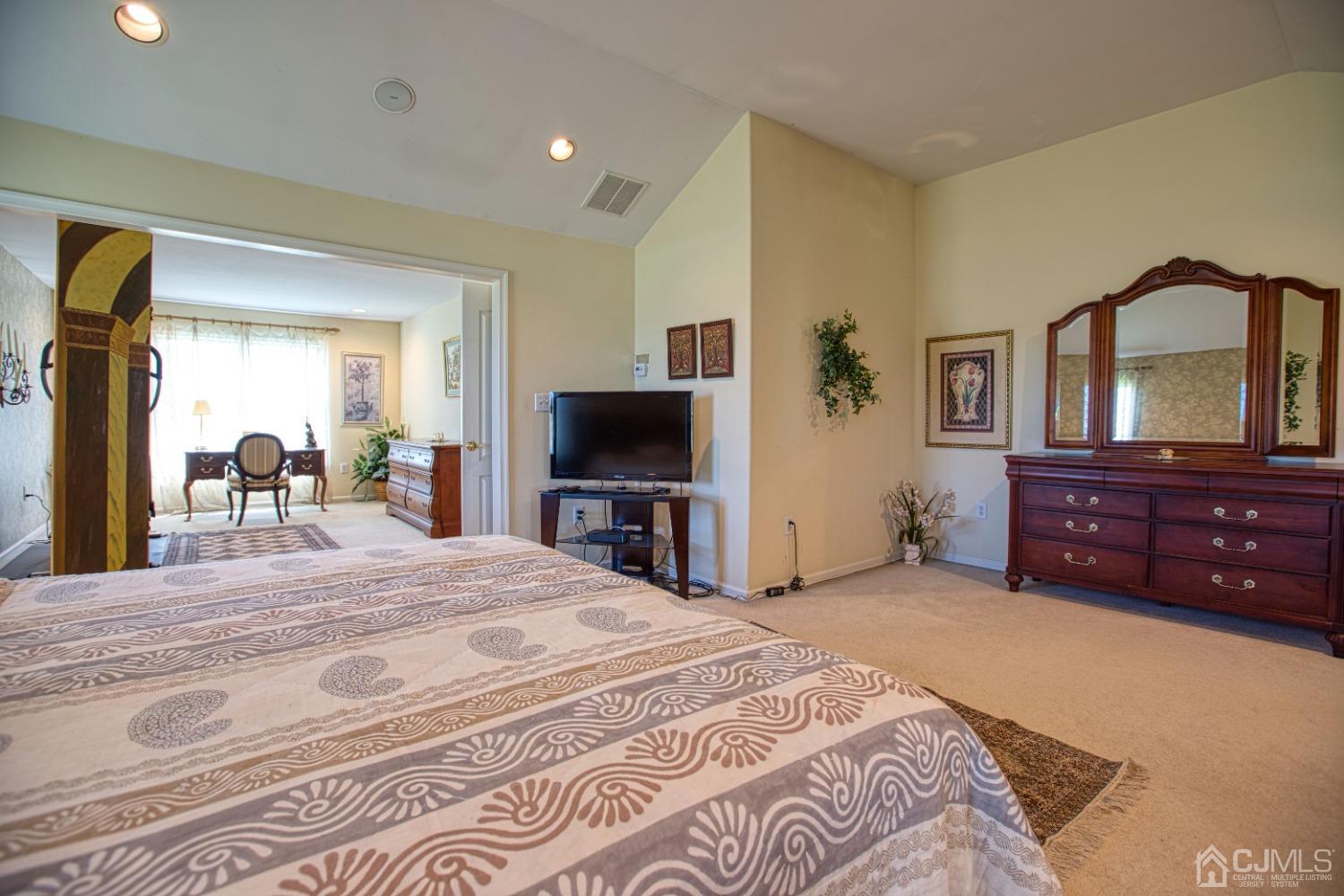 17 Grovers Mill Road Plainsboro, NJ 08536 - Photo 52 of 69 a bedroom with a bed and a flat screen tv