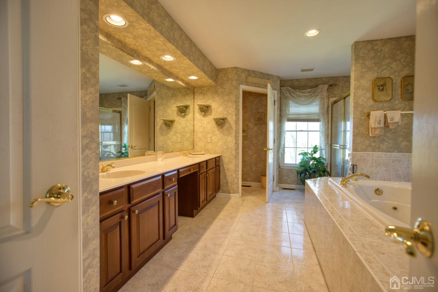 17 Grovers Mill Road Plainsboro, NJ 08536 - Photo 53 of 69 a spacious bathroom with a tub sink shower and mirror